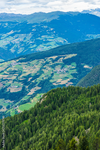 Alpe di Siusi, Seiser Alm with Sassolungo Langkofel Dolomite, a view of a large mountain in the background