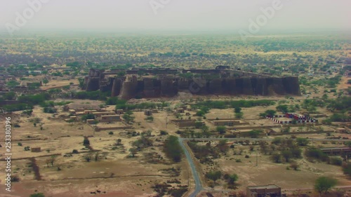 Aerial flight over the The historically-significant Derawar fort, Enormous and impressive structure in the heart of the Cholistan desert, Located south of the city of Bahawalpur, Pakistan photo