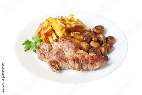 steak with fried potatoes and mushrooms isolated side view