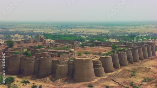 Aerial flight over the The historically-significant Derawar fort, Enormous and impressive structure in the heart of the Cholistan desert, Located south of the city of Bahawalpur, Pakistan photo