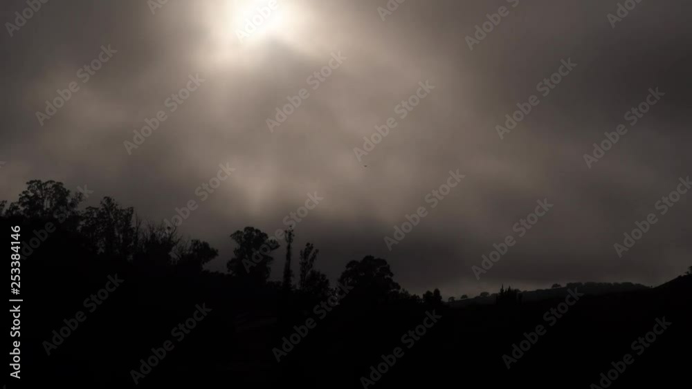 A time lapse of fog and clouds while the sun goes down A time lapse of fog and clouds while the sun goes down
