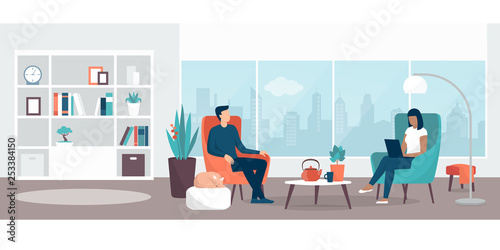 Couple relaxing at home in the living room