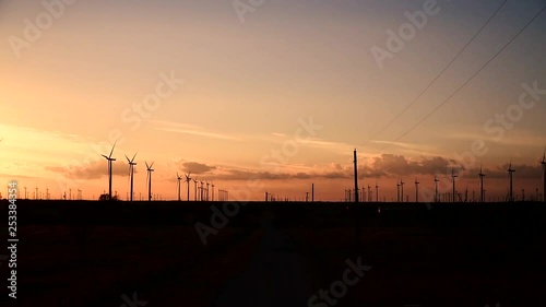 Sunset footage of windmills in central texas. photo