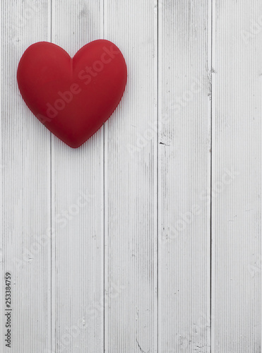 Symbol of love, red heart on a white wooden background, Greeting card. Valentines day concept