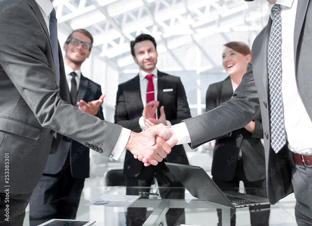 handshake business partners standing in the office handshake business partners standing in the office