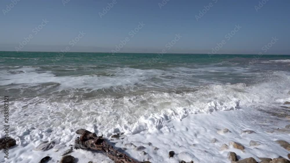 A Big Dead Sea Waves Crashing the Coastline on a Sunny Beautiful Day in Slow Motion A Big Dead Sea Waves Crashing the Coastline on a Sunny Beautiful Day in Slow Motion