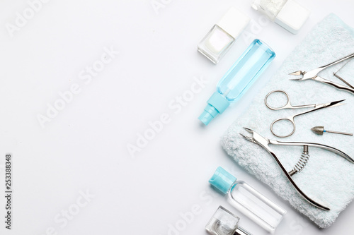 Composition of tools for manicure and cosmetics on a white background with space for text.