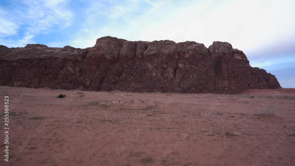 A Timelapse of Clouds Passing By a Hill in a Wadi Rum Desert A Timelapse of Clouds Passing By a Hill in a Wadi Rum Desert