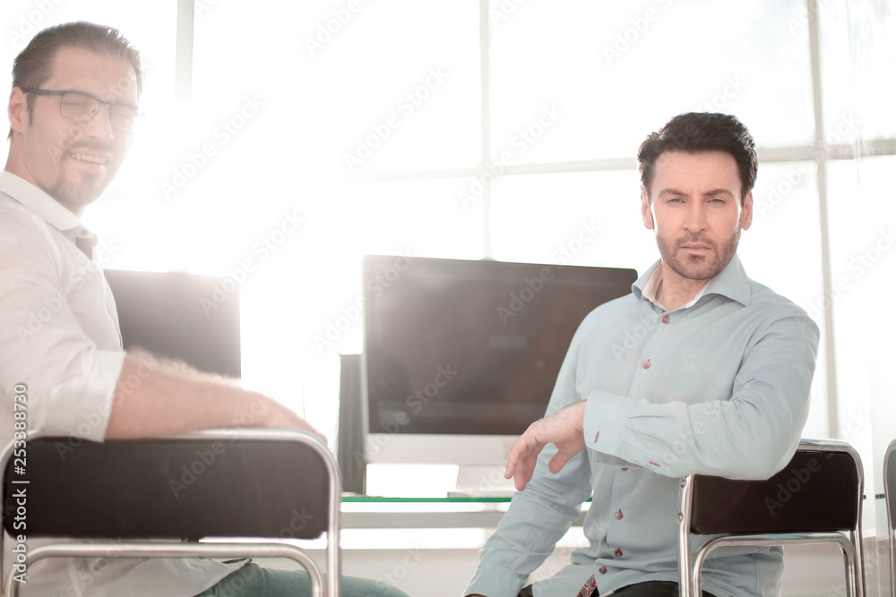 Fototapeta premium Manager and employee sitting near the desktop