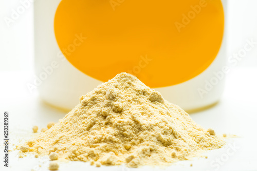 Light yellow powder and can. Soya lecithin powder photo