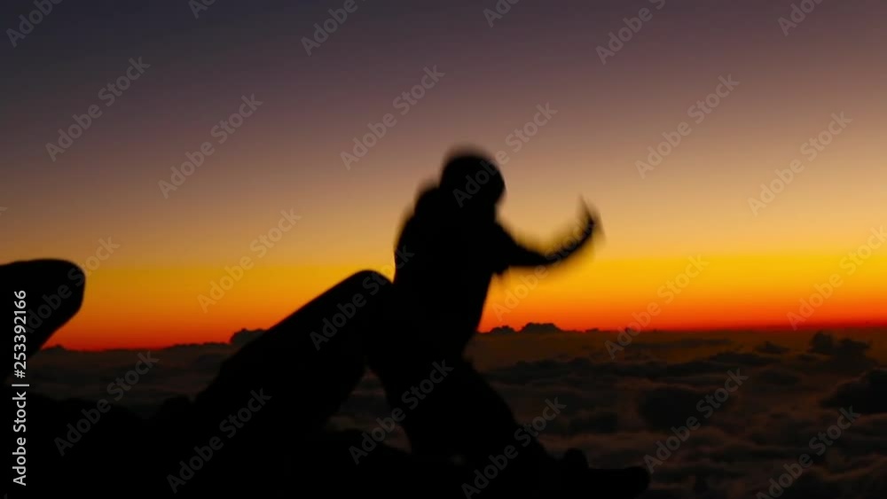Men play at Haleakala Crater at Sunset Men play at Haleakala Crater at Sunset