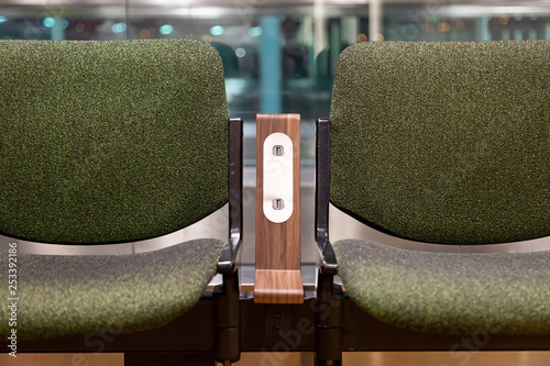 Wallpaper Mural Green chairs with  free standard USB power socket or USB port slot charger in airport. Travelling comfort Torontodigital.ca