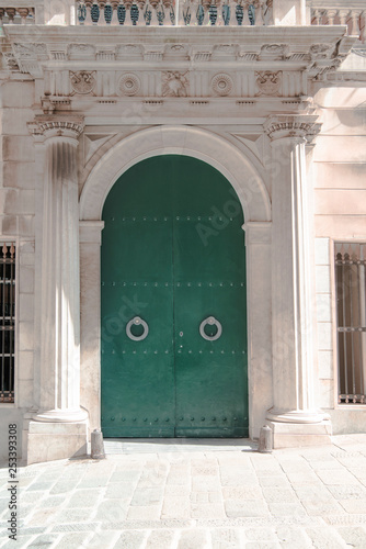 Arched ancient door on the streets of Genova © YesPhotographers