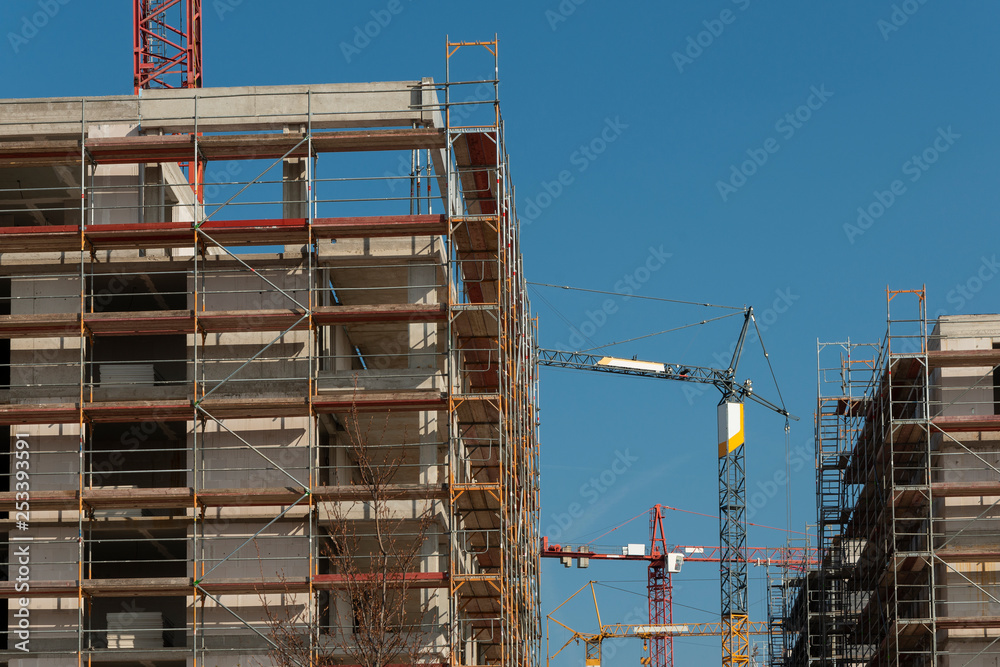 Construction site of an apartment building with crane