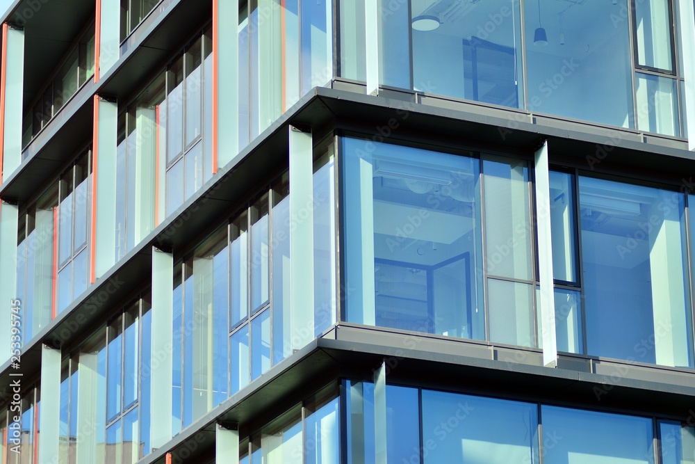 Sky reflected in a modern building glass facade Sky reflected in a modern building glass facade