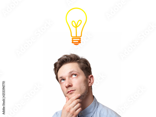 Young man with thoughtful expression and light bulb over his head