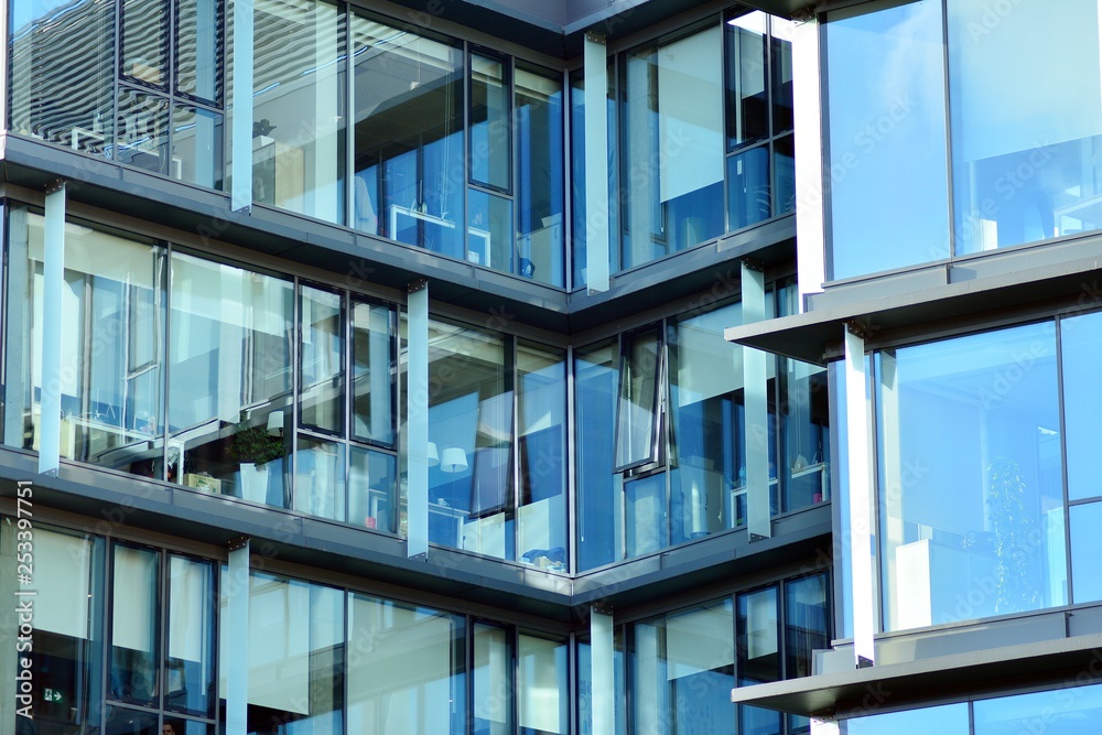 Sky reflected in a modern building glass facade Sky reflected in a modern building glass facade