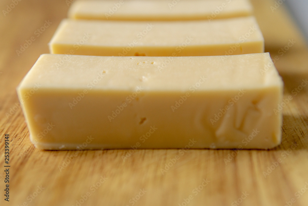 Cheese on a wooden board Cheese on a wooden board