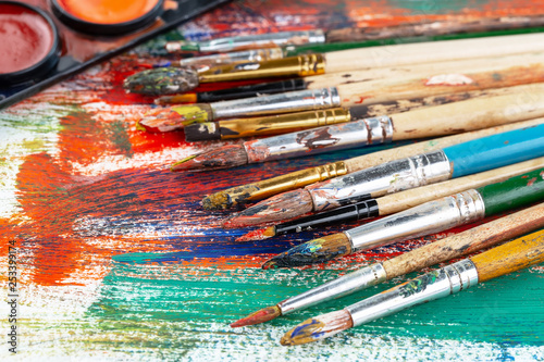 Paint brushes and paints for drawing.