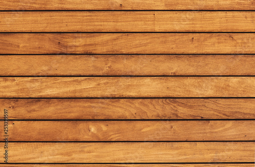 The texture of the pine boards. Horizontal wooden fence.