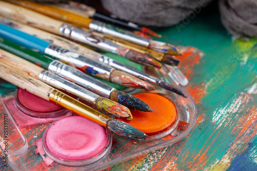 Paint brushes and paints for drawing.