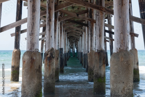 The Under Side of a Pier in a California Beach