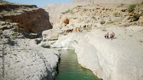 Wadi Bani Khalid is It is a very popular outdoor attraction for both locals and expats, and people come here for the nature, to swim in the fresh water pools or just to have a barbecue. ( Wide shot#2) photo