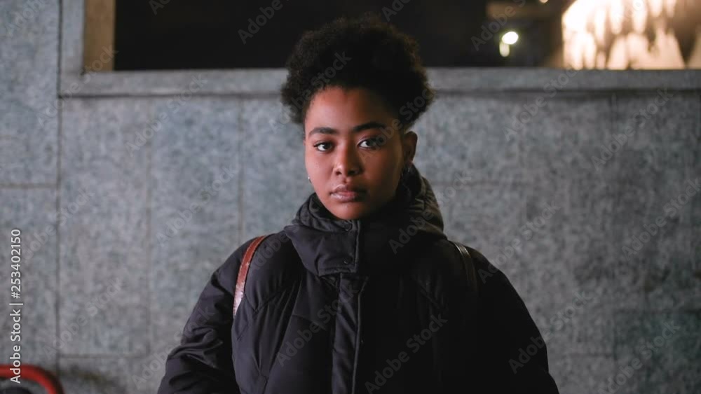 Slow motion black young woman outdoor looking camera in slow motion – carefree, thoughtless, girl power concept Slow motion black young woman outdoor looking camera in slow motion – carefree, thoughtless, girl power concept