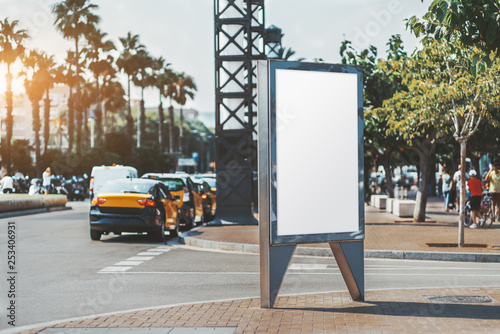 Photography Mockup of an empty advertising poster on the street near the road with multiple