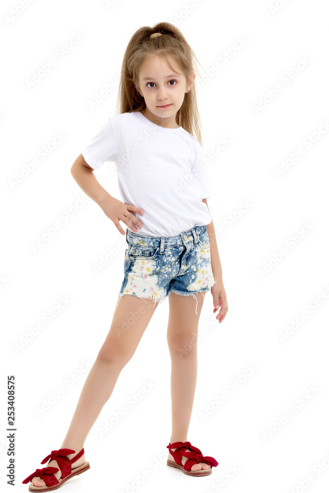 Little girl in a pure white t-shirt for advertising and shorts. Little girl in a pure white t-shirt for advertising and shorts.