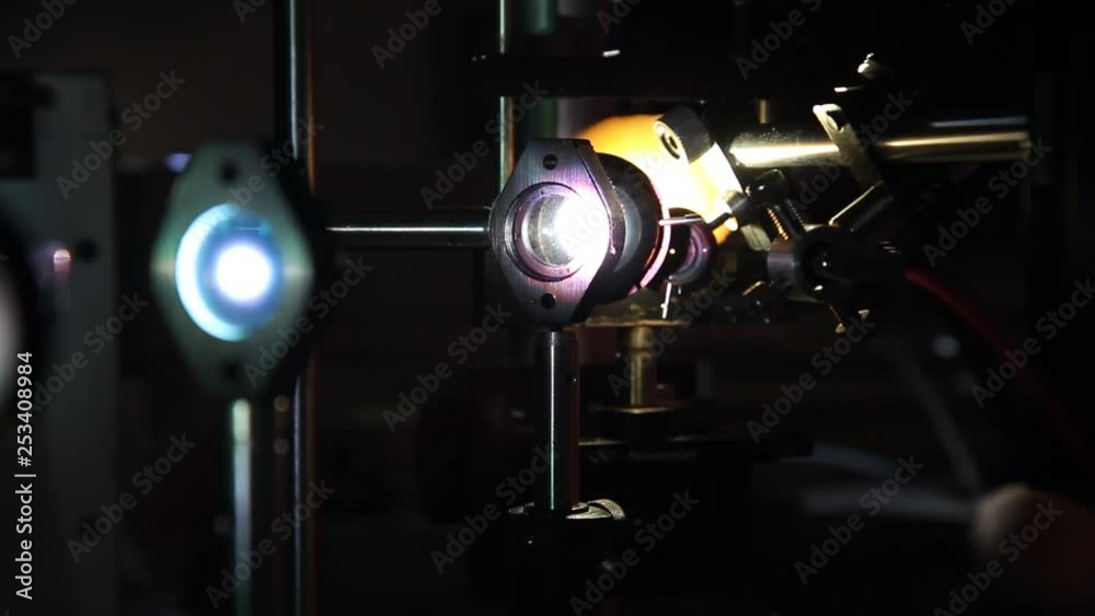 Photonics test with lenses. Light through lenses experiment. Photonics scientific experiments
