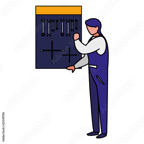 mechanic worker with tools board hanging