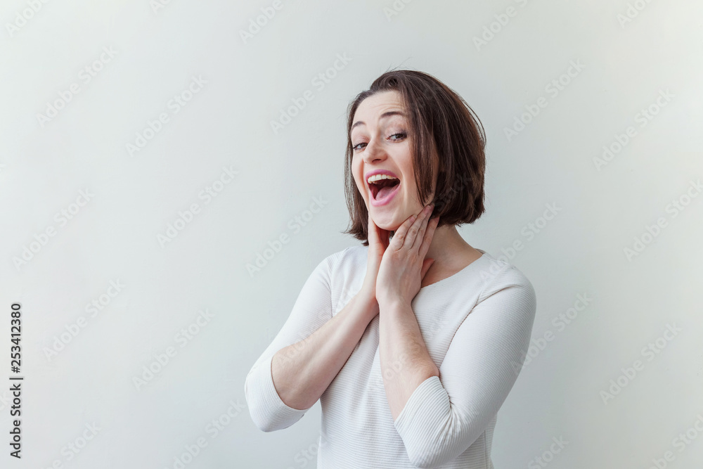 Happy girl smiling. Beauty portrait young happy positive laughing brunette woman on white background isolated. European woman. Positive human emotion facial expression body language Happy girl smiling. Beauty portrait young happy positive laughing brunette woman on white background isolated. European woman. Positive human emotion facial expression body language