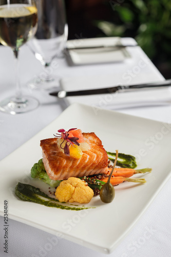 restaurant salmon entree with white wine