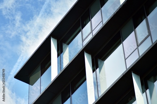 Sky reflected in a modern building glass facade