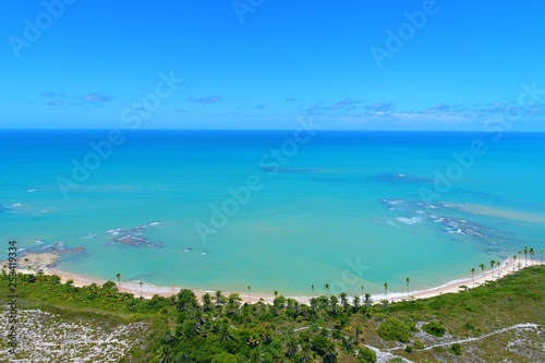 Aerial view of Cumuruxatiba Beach, Prado, Bahia, Brazil. Great landscape. Beautiful beach and river sceneries. Tropical travel. Travel Destination. Vacation travel. Nature scenery.