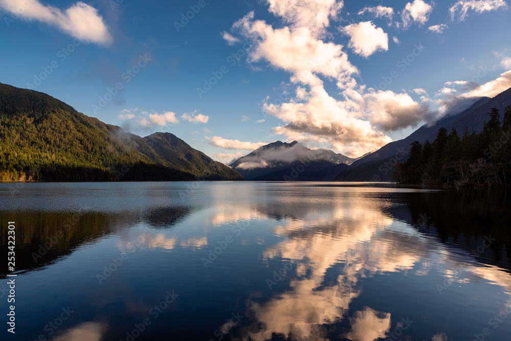 Clouds and Mountains reflect off a lake in Olympic National Park, Washington