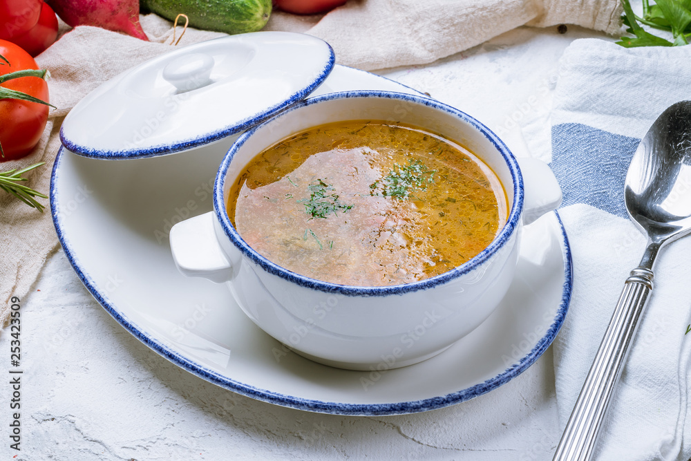 Chicken soup bouillon in a plate Chicken soup bouillon in a plate