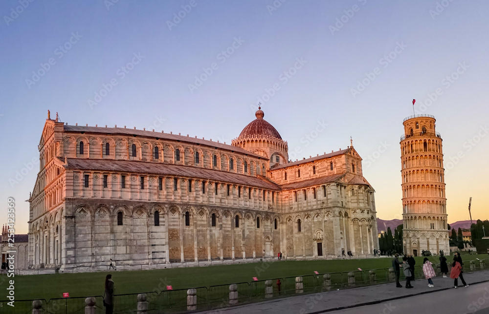 Pisa / Italy 23 february 2019 : snapshot of the leaning tower and the cathedral during sunset