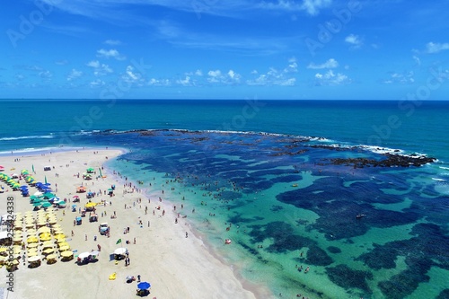 Aerial view of Porto de Galinhas's Beach, Pernambuco, Brazil: Vacation on the paradisiac beach with fantastics natural pools. 