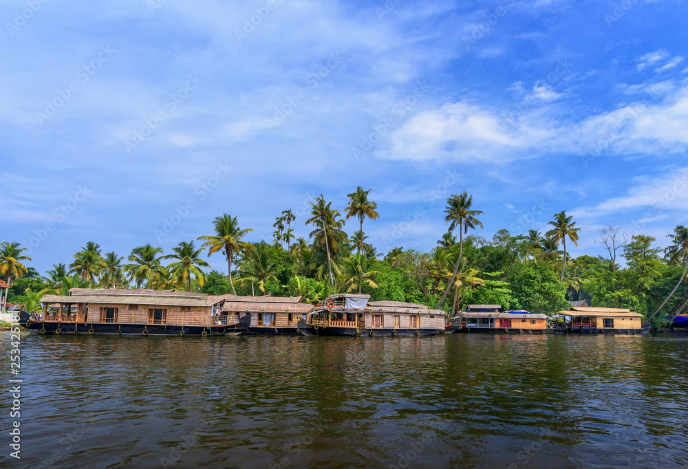 River view and boat in Kerala's Backwaters, India. River view and boat in Kerala's Backwaters, India.