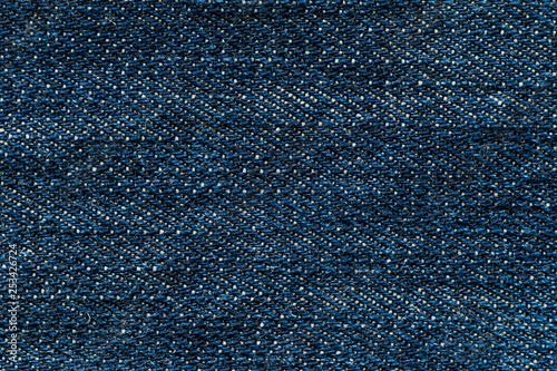 Blue denim jean texture. Macro close up of blue jeans. Fabric material background.