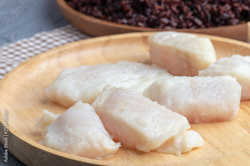 steamed pangasius dory and riceberry rice on wooden plate