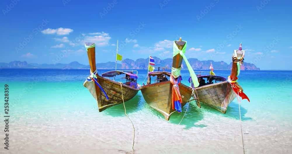 Thailand tourist boats on sea shore of tropical island near Krabi and Phuket. Travel destination background of exotic Asia