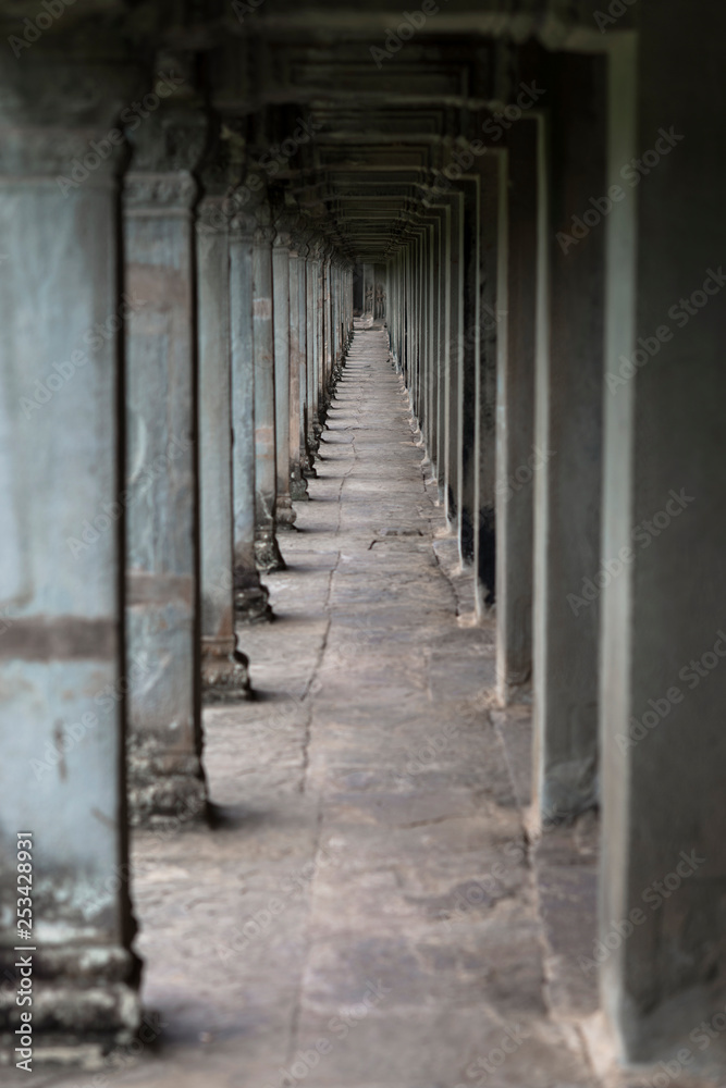 Long gallery with stone columns in Angkor Wat temple, Siem Reap, Cambodia