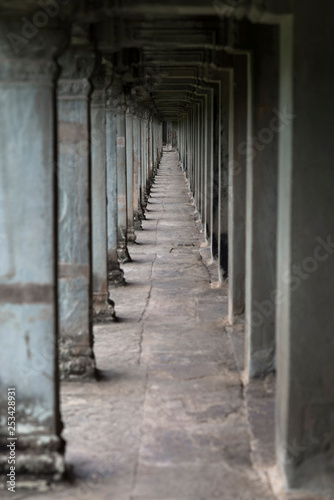 Long gallery with stone columns in Angkor Wat temple, Siem Reap, Cambodia