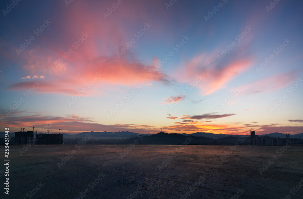 Empty concrete cement floor with dramatic sunrise purple and pink sky . Empty concrete cement floor with dramatic sunrise purple and pink sky .
