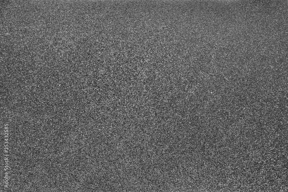 Closeup of dark gray matte metal texture. Shiny metallic surface. Closeup of dark gray matte metal texture. Shiny metallic surface.