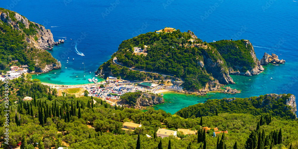 Fototapeta premium Panoramic view of Palaiokastritsa, boats and beach Corfu, Greece