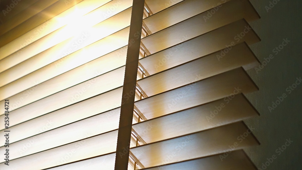 Blinds, Evening sun light outside wooden window blinds, sunshine and shadow on window blind, decorative interior home concept Blinds, Evening sun light outside wooden window blinds, sunshine and shadow on window blind, decorative interior home concept